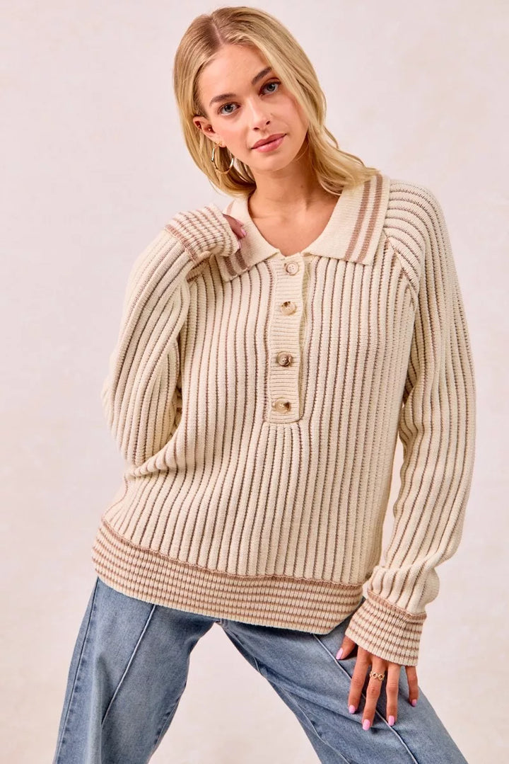 Cream latte ribbed polo sweater styled with wide leg jeans, hand in pocket