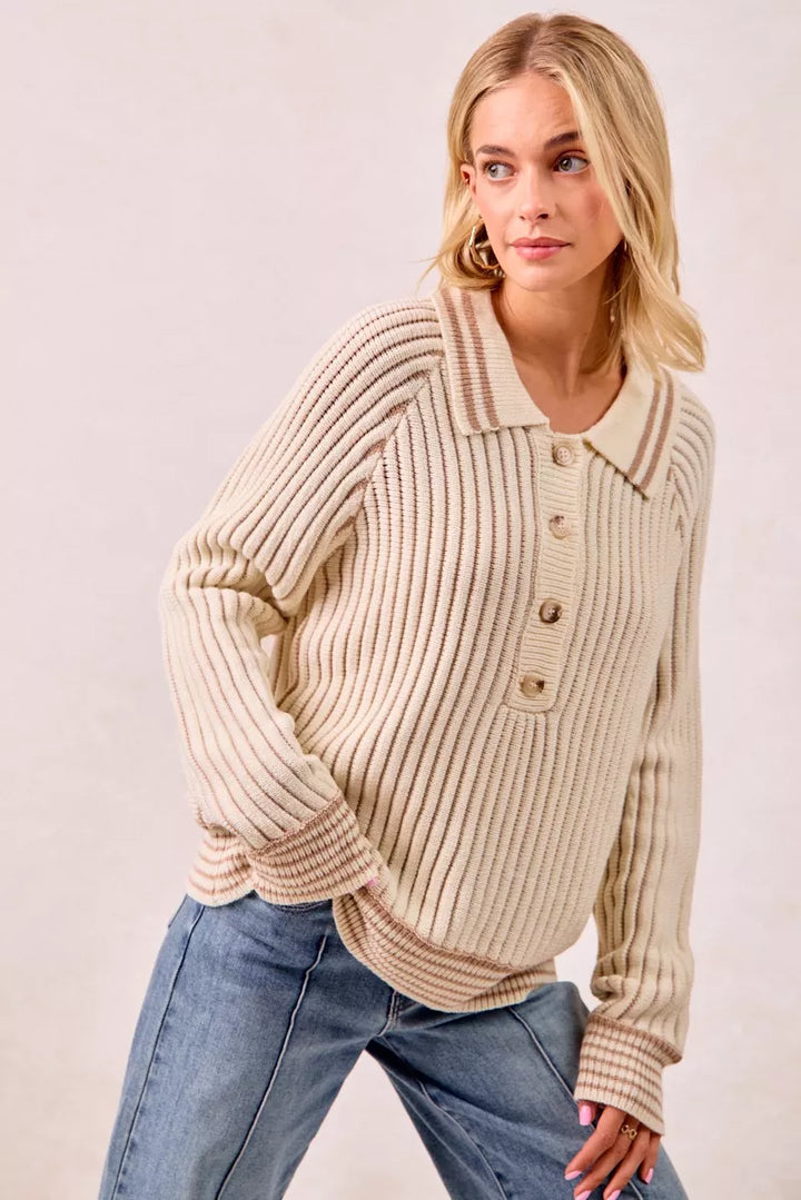 Cream ribbed knit polo sweater angled view with half button placket
