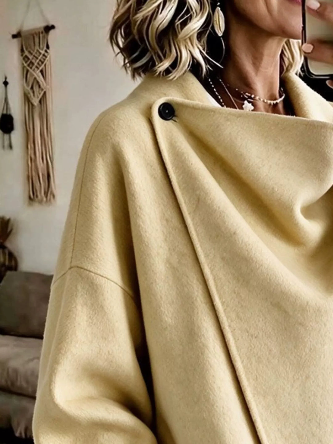 Asymmetric cowl neck draped plus size in light yellow, close-up detail