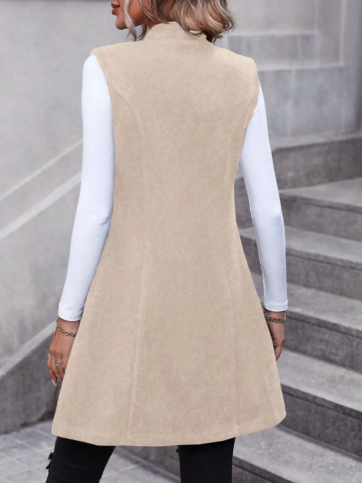 Longline stand collar button side pockets in apricot, back view