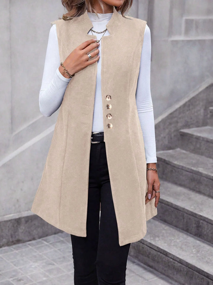 Longline stand collar button side pockets in apricot, styled on model 2