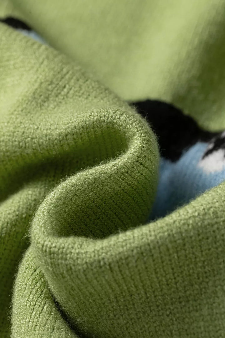 Detail of the rolled neckline with a glimpse of the blue fish graphic