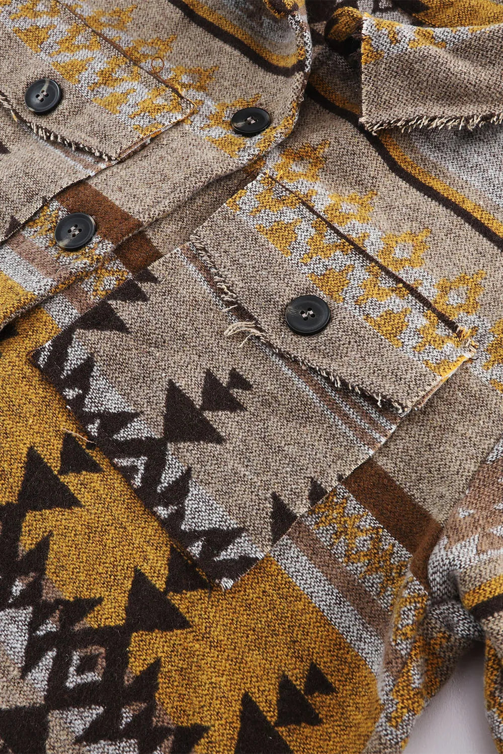 Geometric print button front raw-edge in camel, close-up detail 2