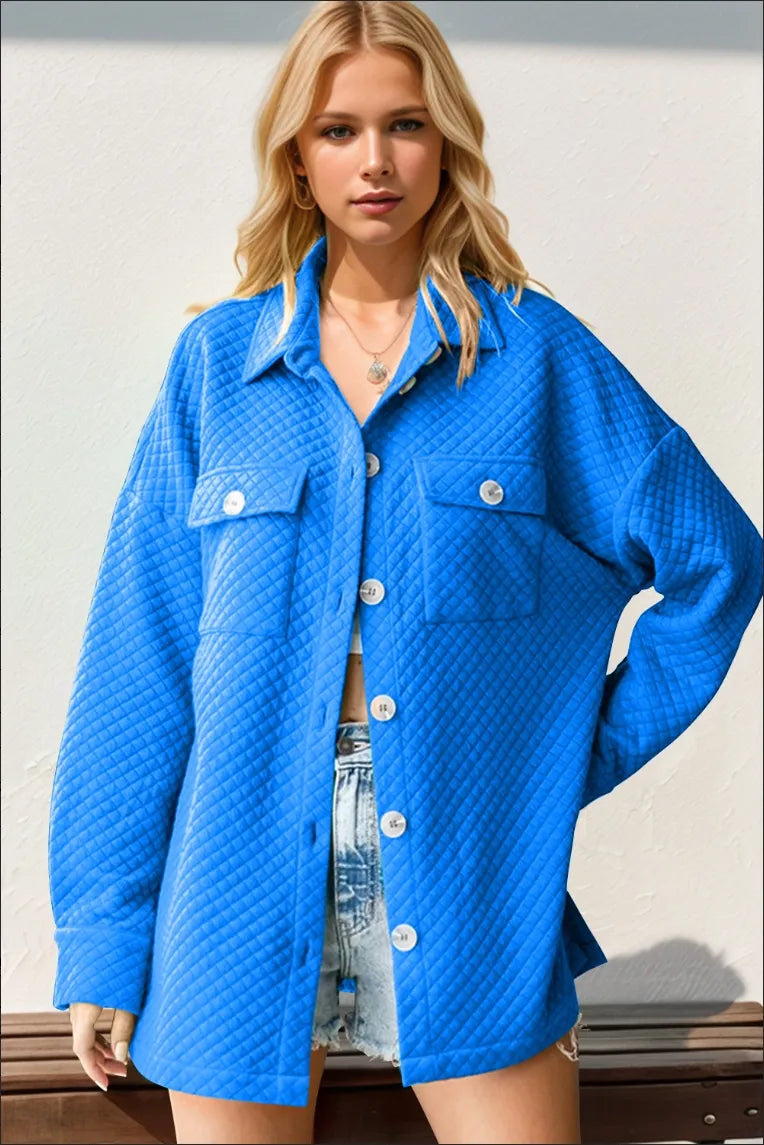 Oversized cobalt blue button up shacket styled with denim shorts, front view
