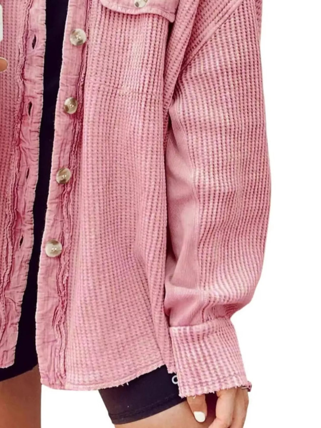 Close-up of the pink waffle knit shacket sleeve and front buttons