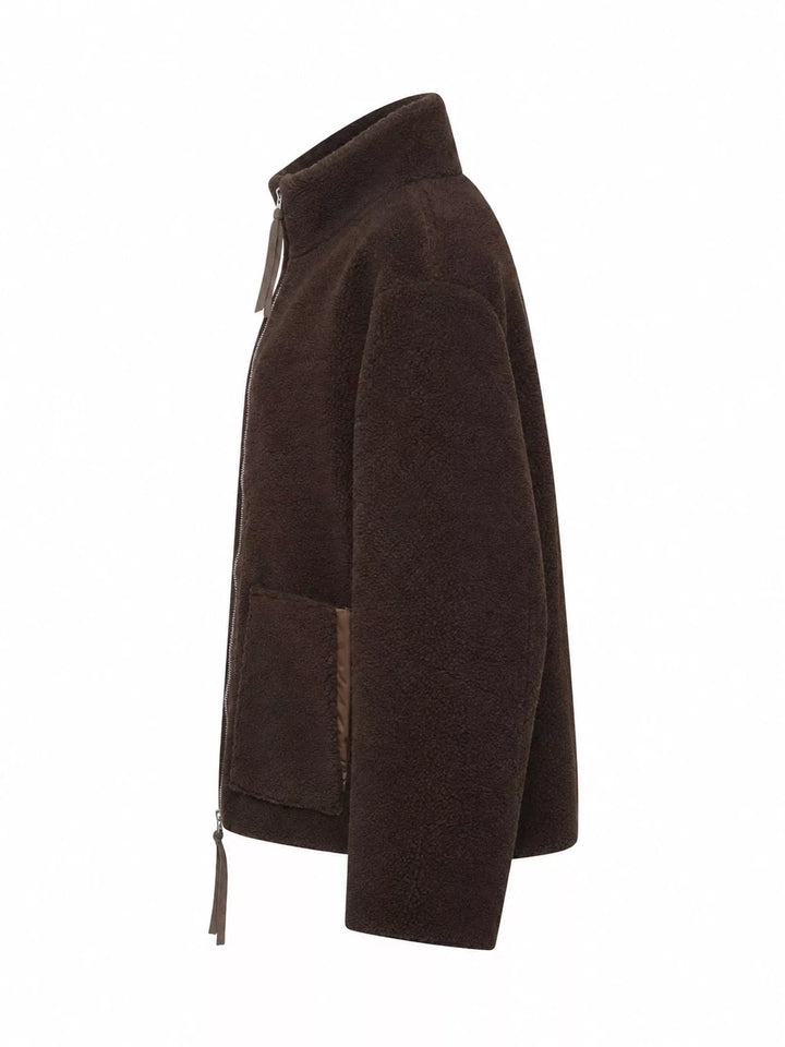 Stand collar full zip drawcord hem in reddish brown, styled on model