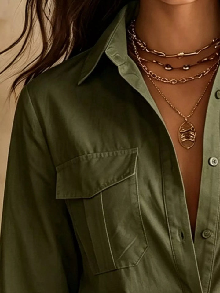 Close-up of the button down front on the army green shirt dress
