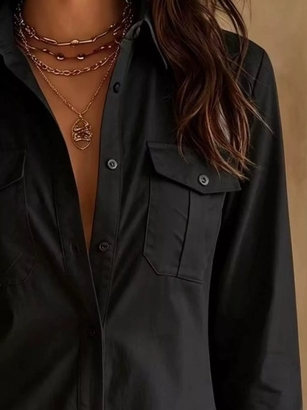 Close-up of the button down front on the black shirt dress