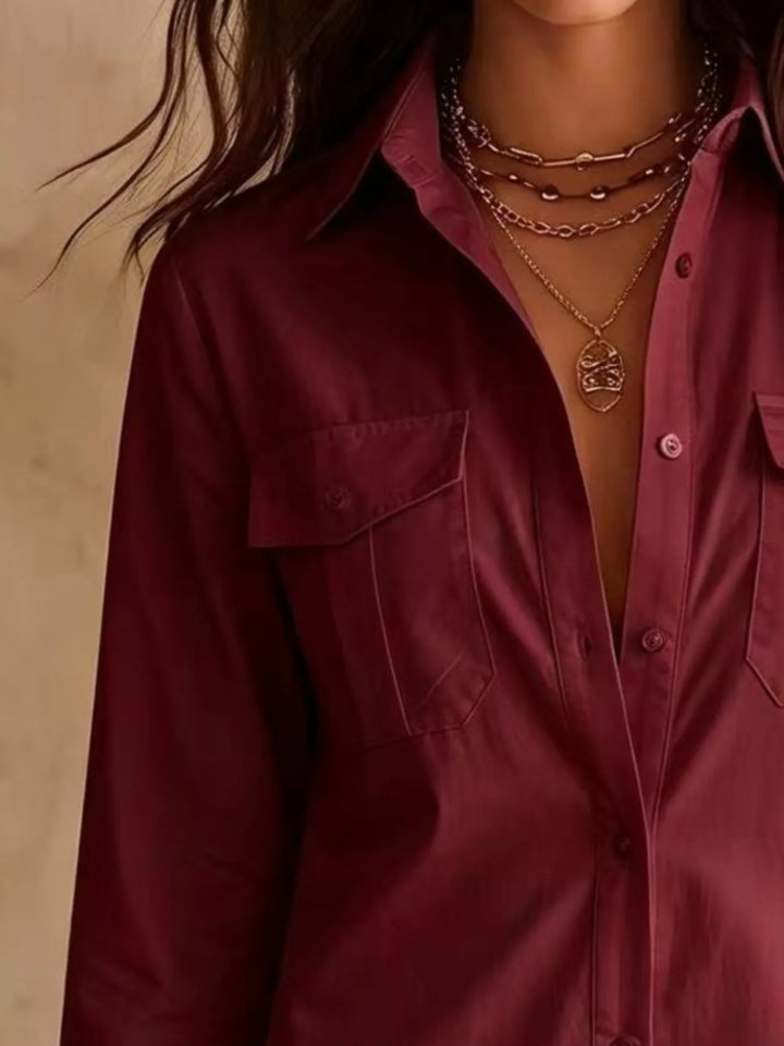 Close-up of the button down front on the burgundy shirt dress