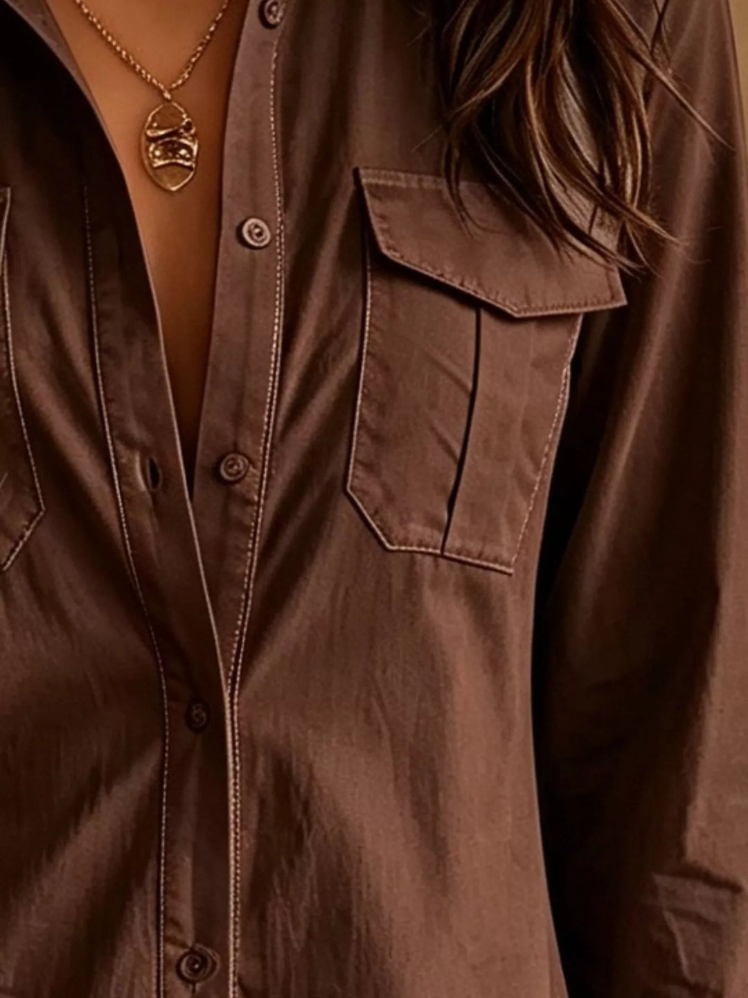 Close-up of the button down front on the dark brown shirt dress