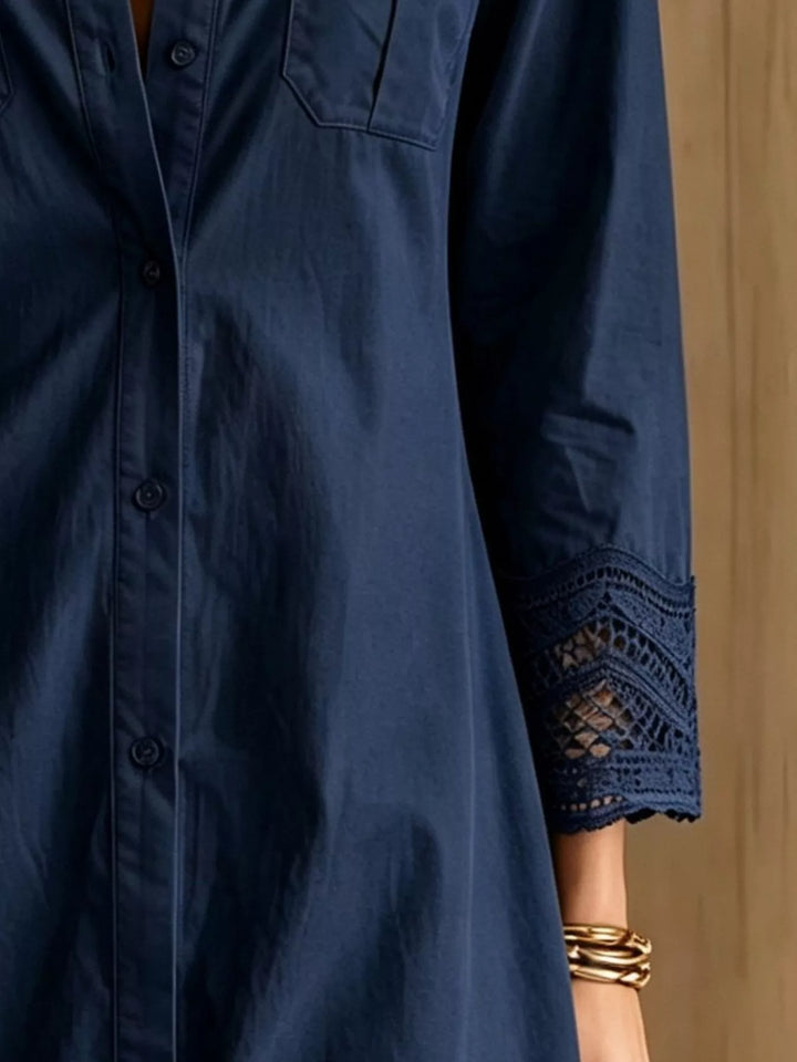 Close-up of the button down front on the navy blue shirt dress