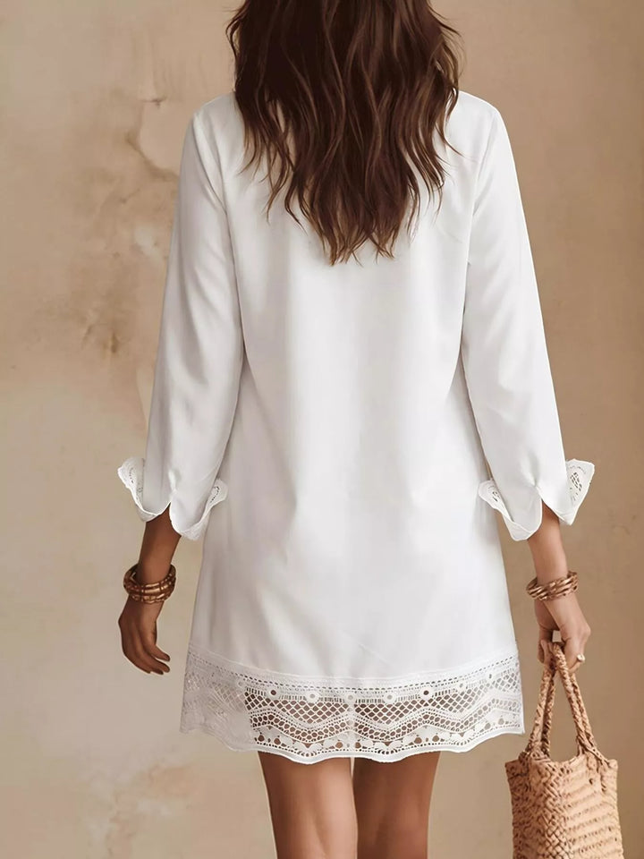 White shirt dress worn on a model, showing the chest pocket