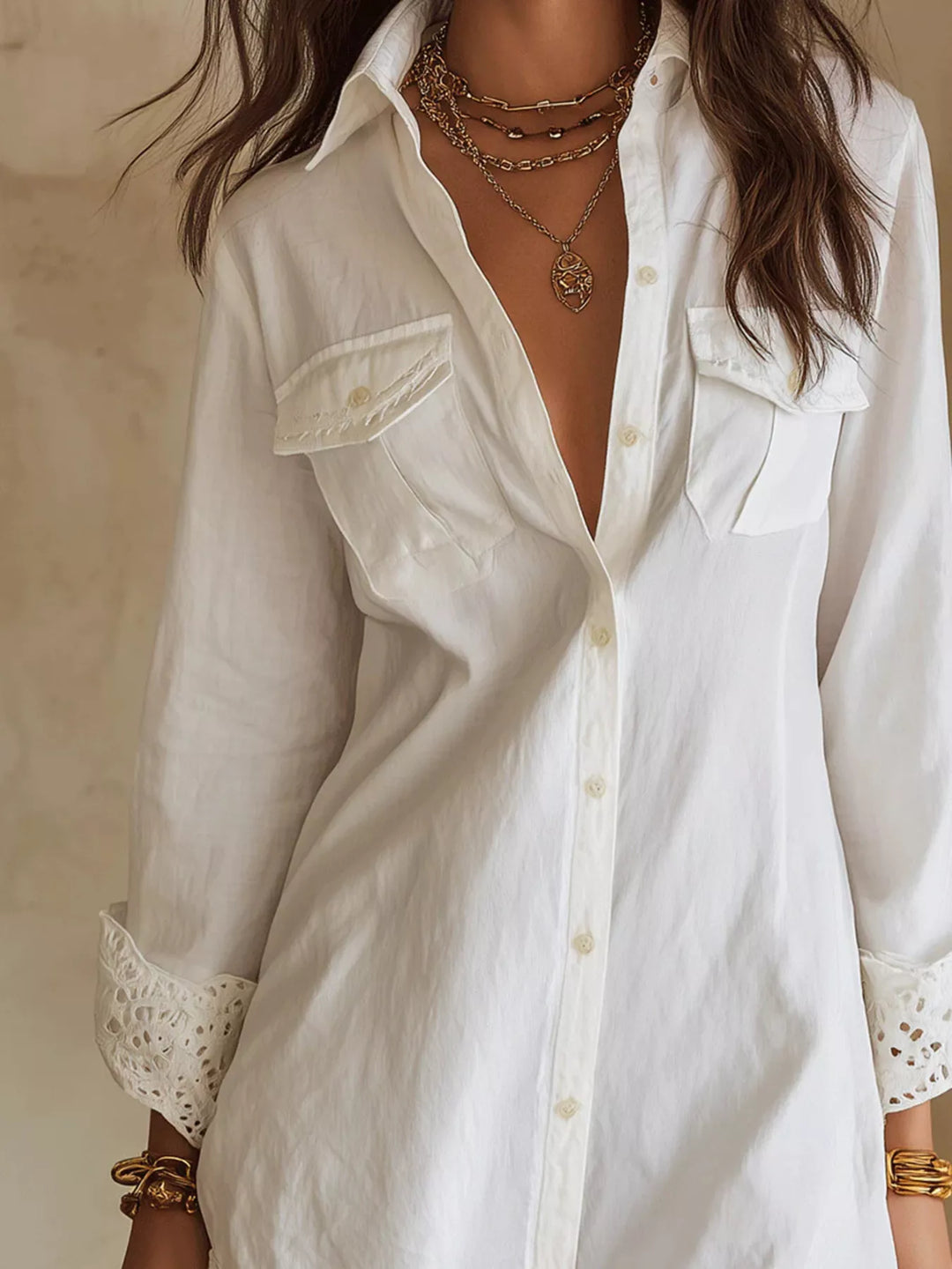 White shirt dress worn on a model, showing the lace trim hem