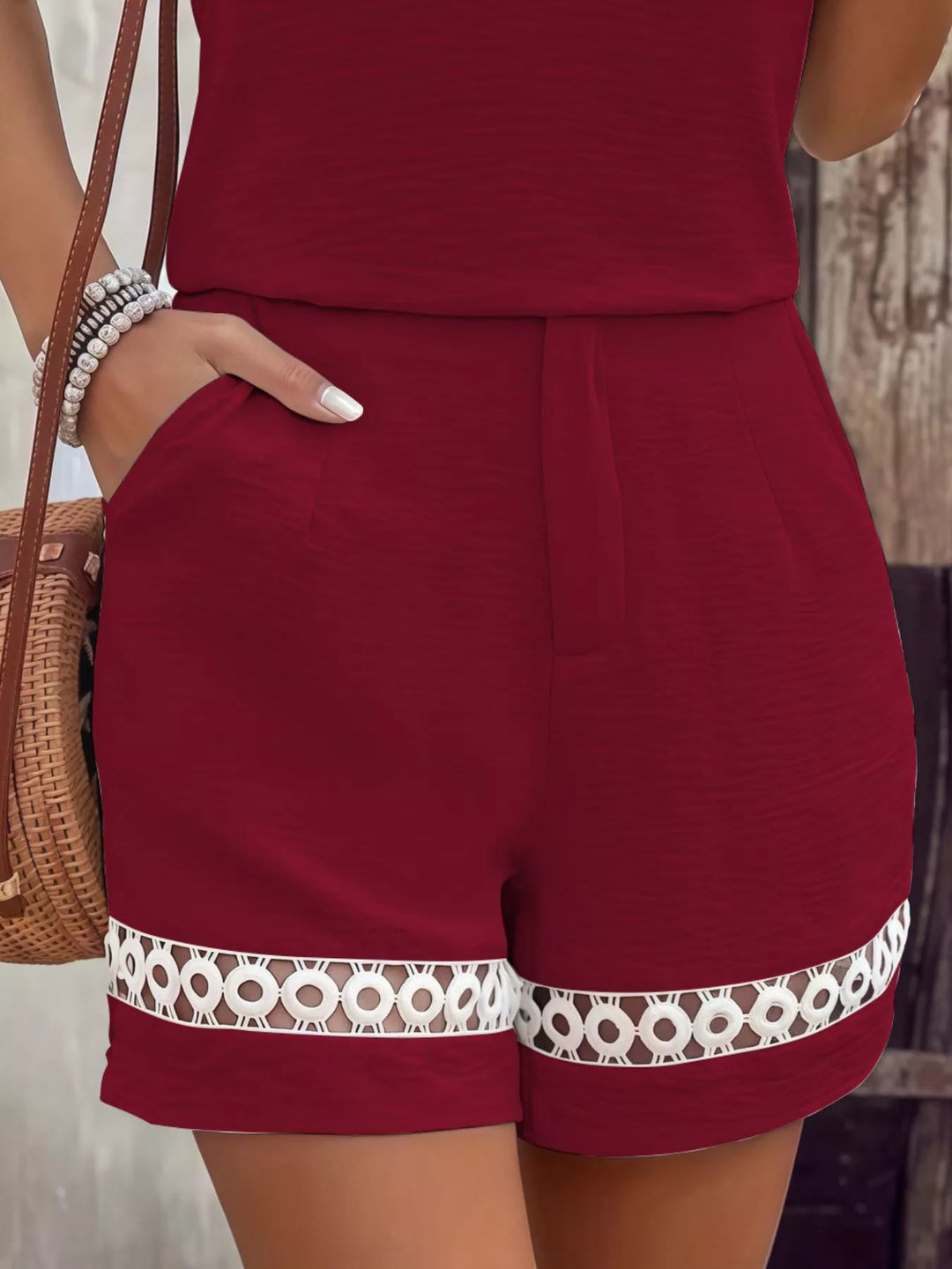 Burgundy shorts with crochet lace trim hem and pocket, close-up