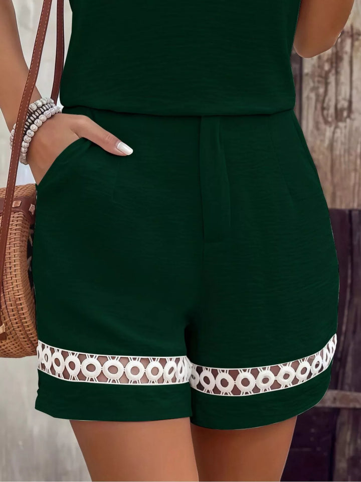 Dark green shorts with crochet lace trim hem and pocket, close-up
