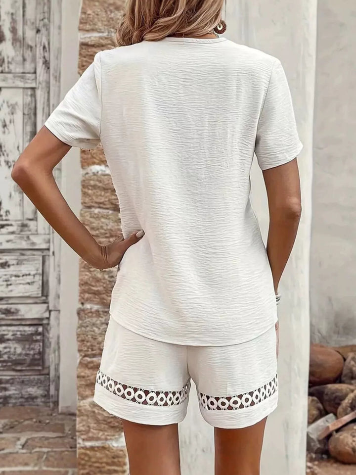 White short set back view with lace trim along the shorts hem
