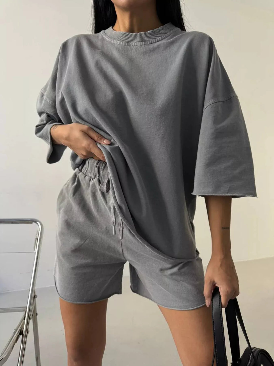 Women's shorts set in gray with an oversized vintage wash tee and shorts