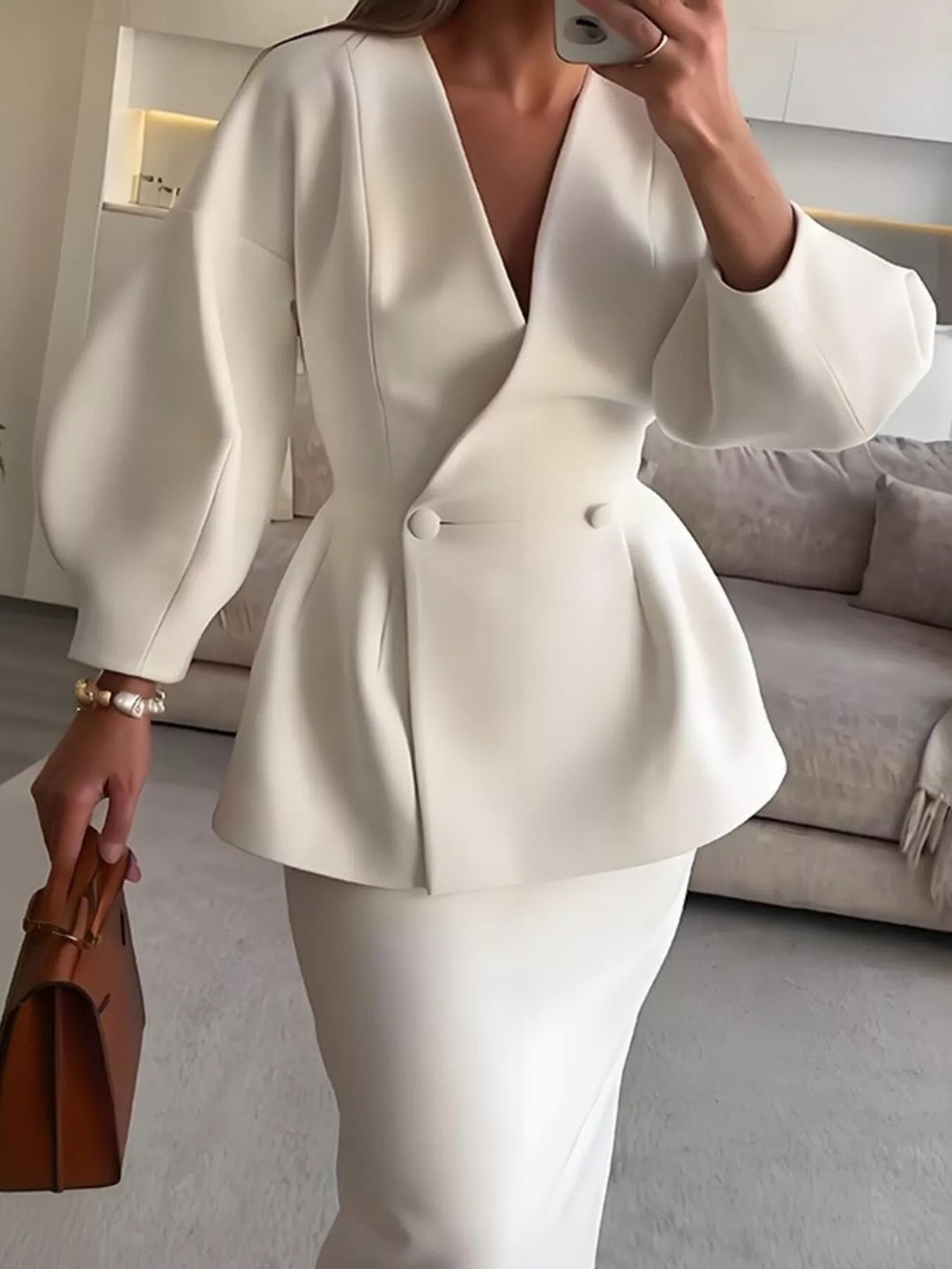 Side view of the white peplum blazer and midi pencil skirt