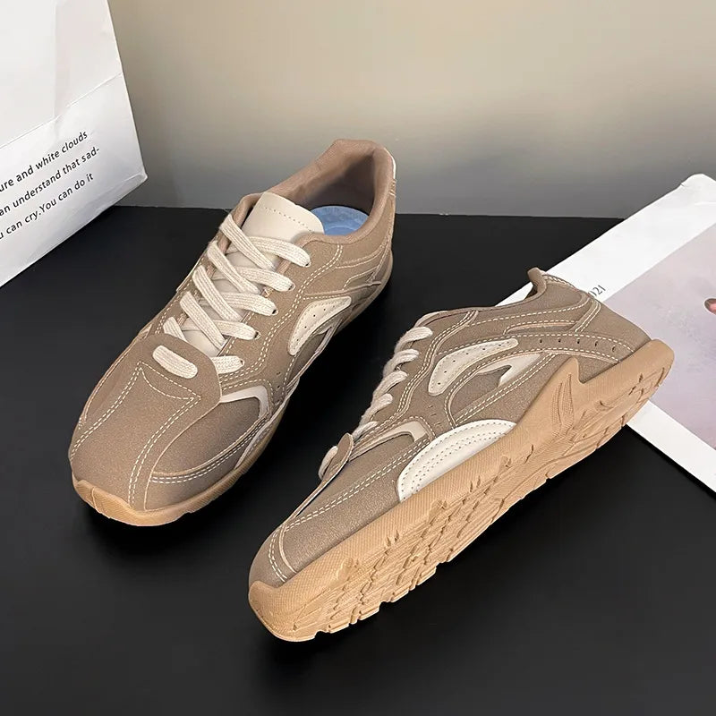 Pair of camel sneakers with cream contrast panels, top and side angles