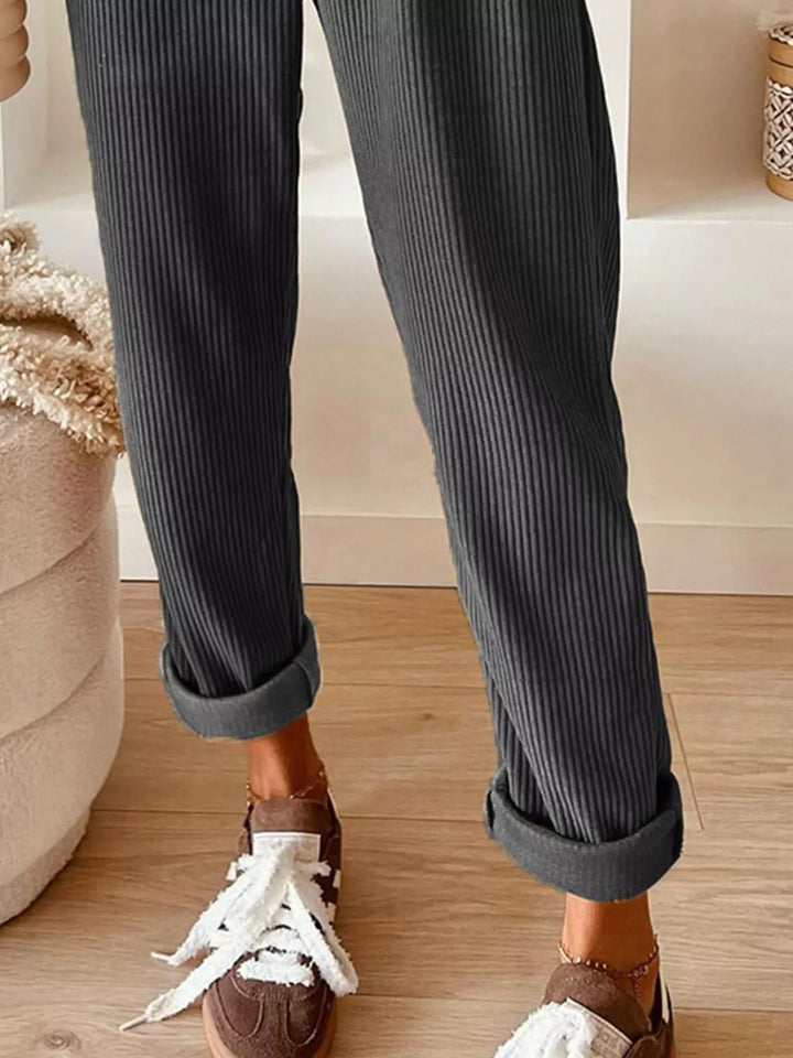 Charcoal cuffed ankle straight leg pants with white sneakers