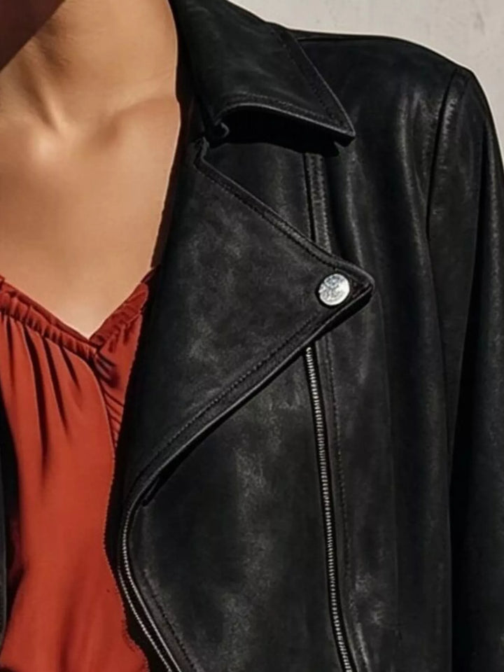 Cropped moto fringe hem asymmetric zip in black, close-up detail