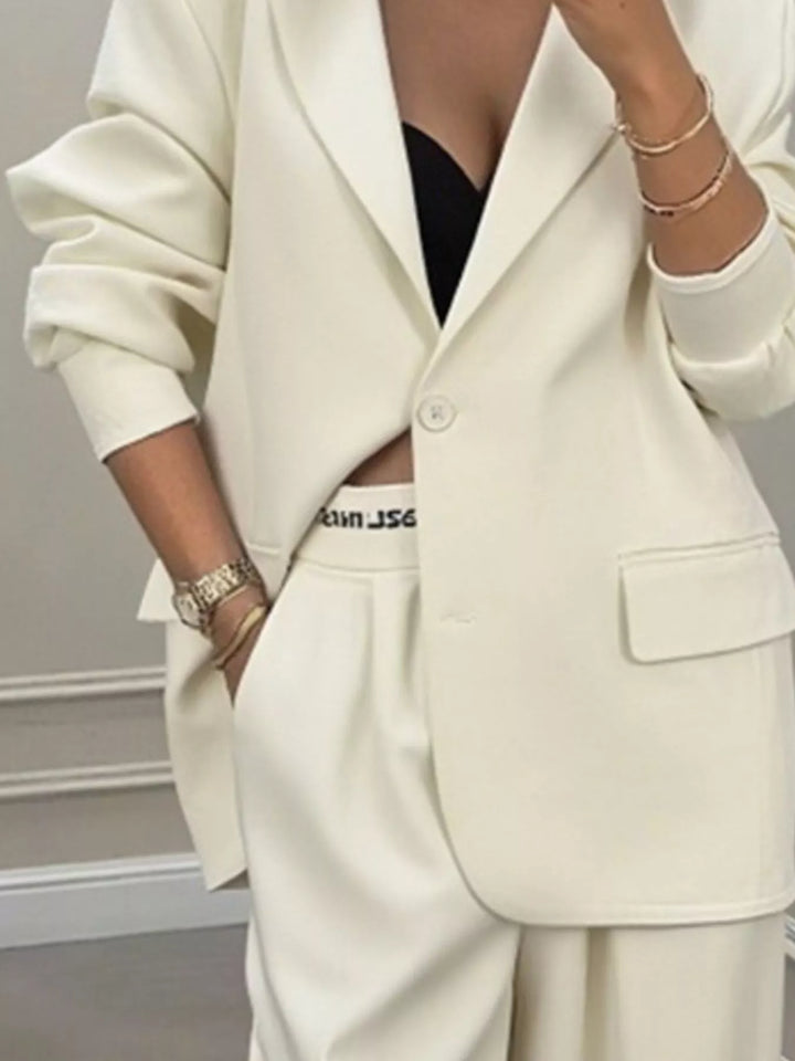 Oversized one button blazer and wide leg pants in apricot, close-up detail