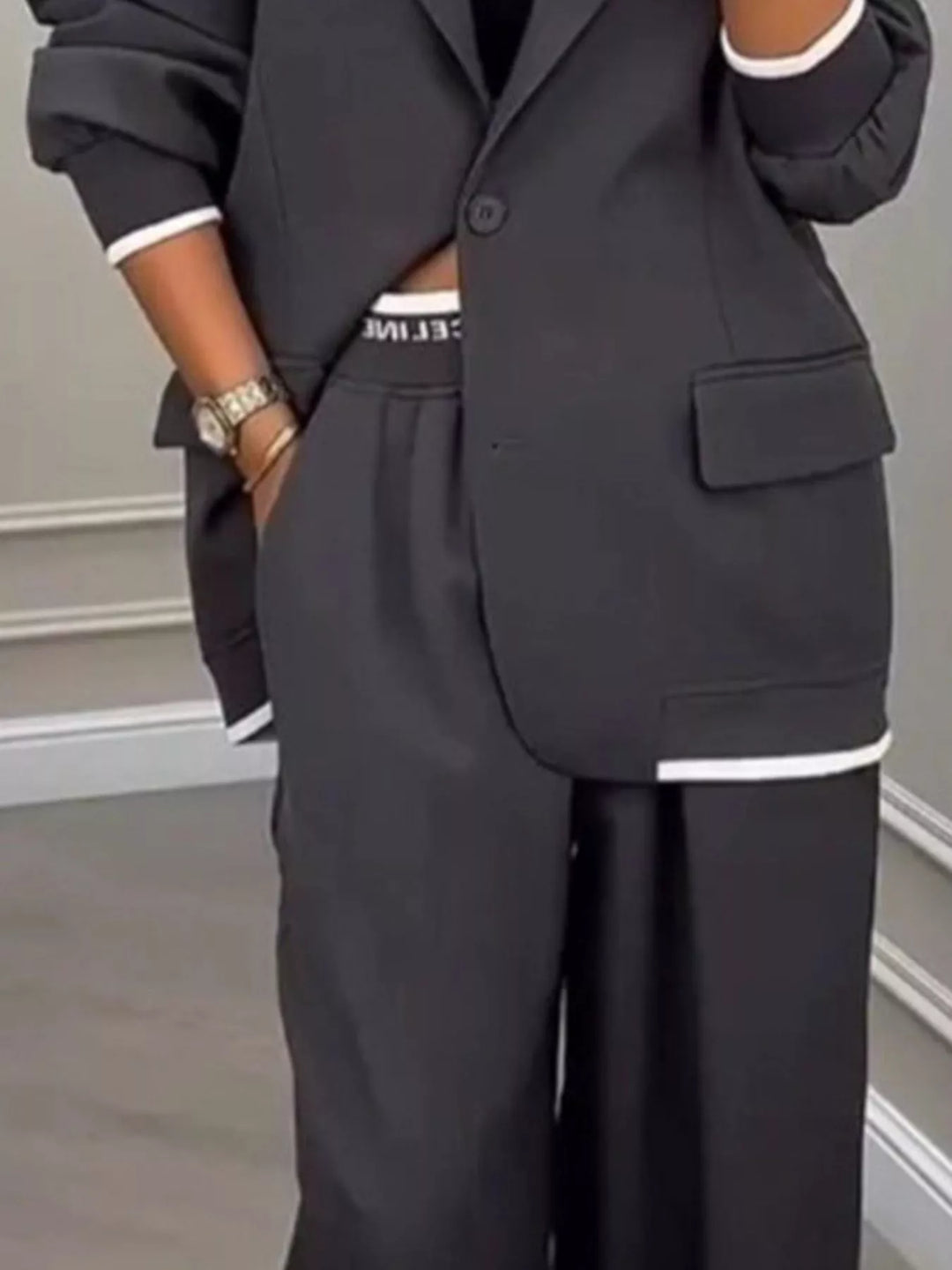 Oversized one button blazer and wide leg pants in dark gray, close-up detail