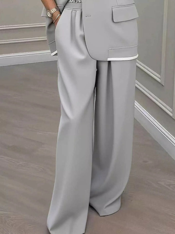 Oversized one button blazer and wide leg pants in gray, close-up detail