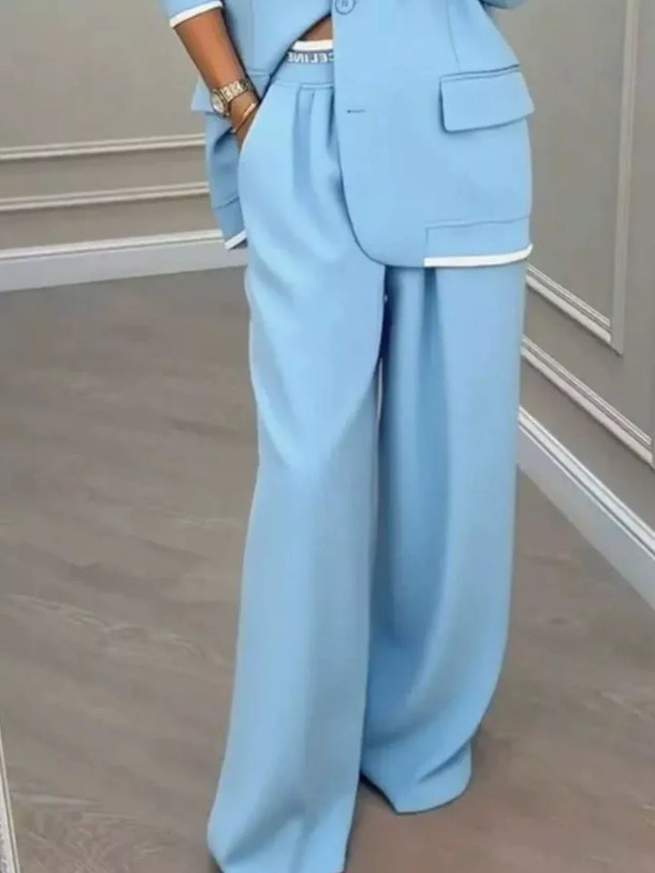 Oversized one button blazer and wide leg pants in sky blue, close-up detail