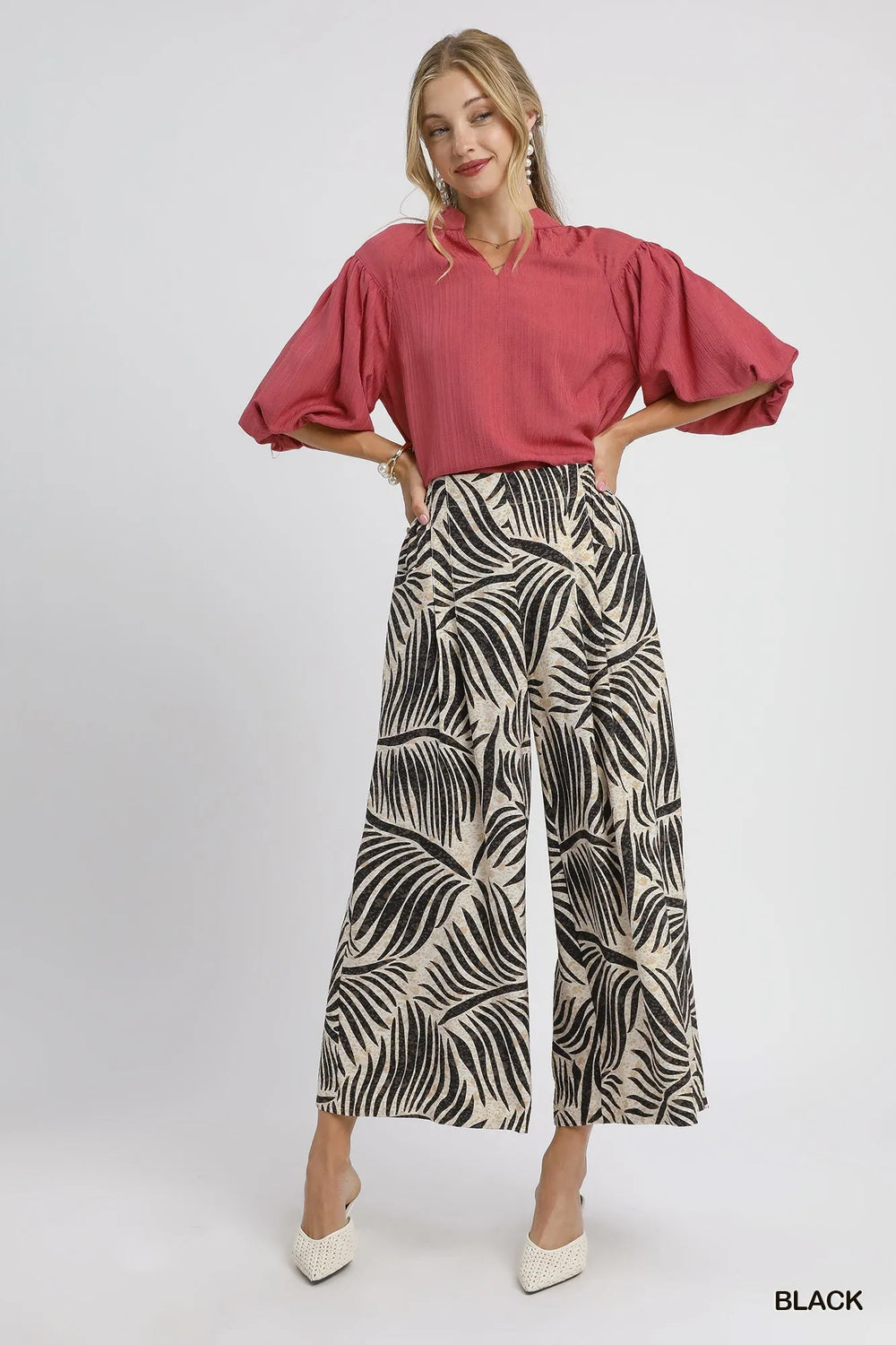 Full-length black and cream palm print culottes styled with a berry puff sleeve top
