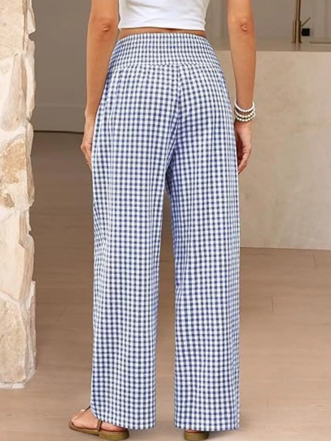 Back view of the blue gingham wide leg pants with smocked waist