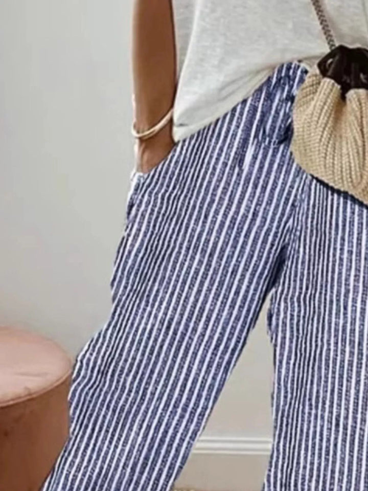 Close-up of the blue striped pants showing the drawstring waist