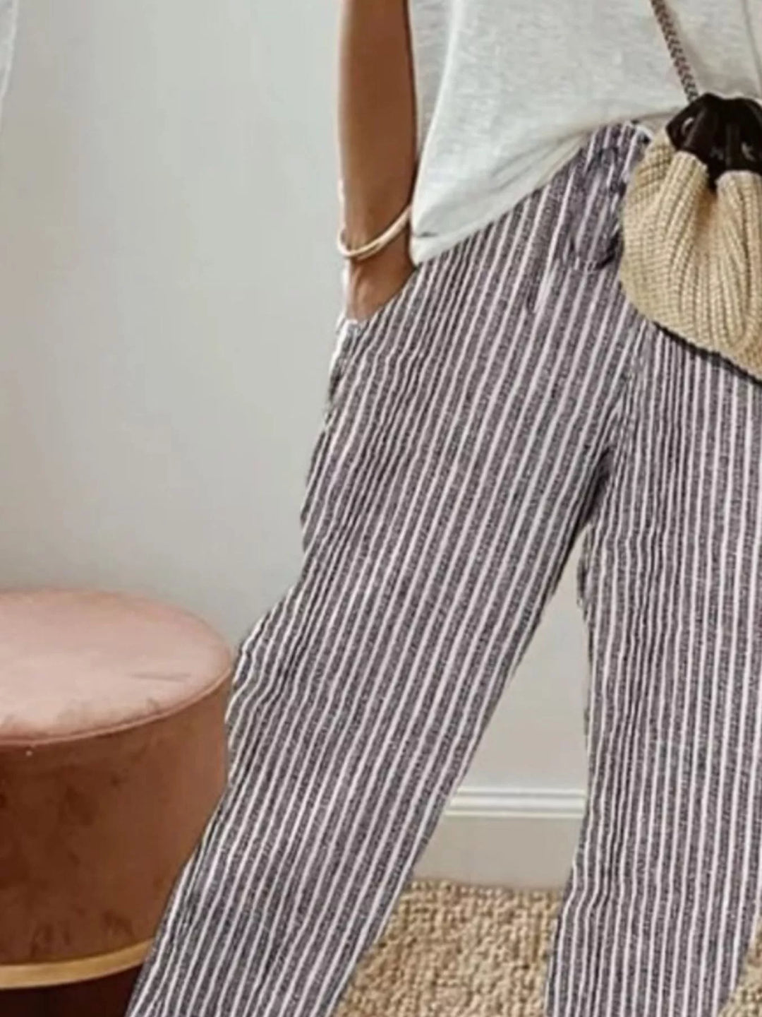 Close-up of the gray striped cropped pants with drawstring waist