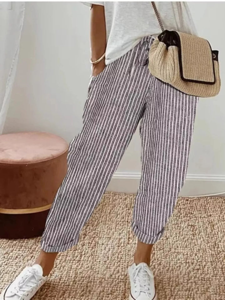 Women's summer pants in gray, striped cropped tapered drawstring, worn with a white tee