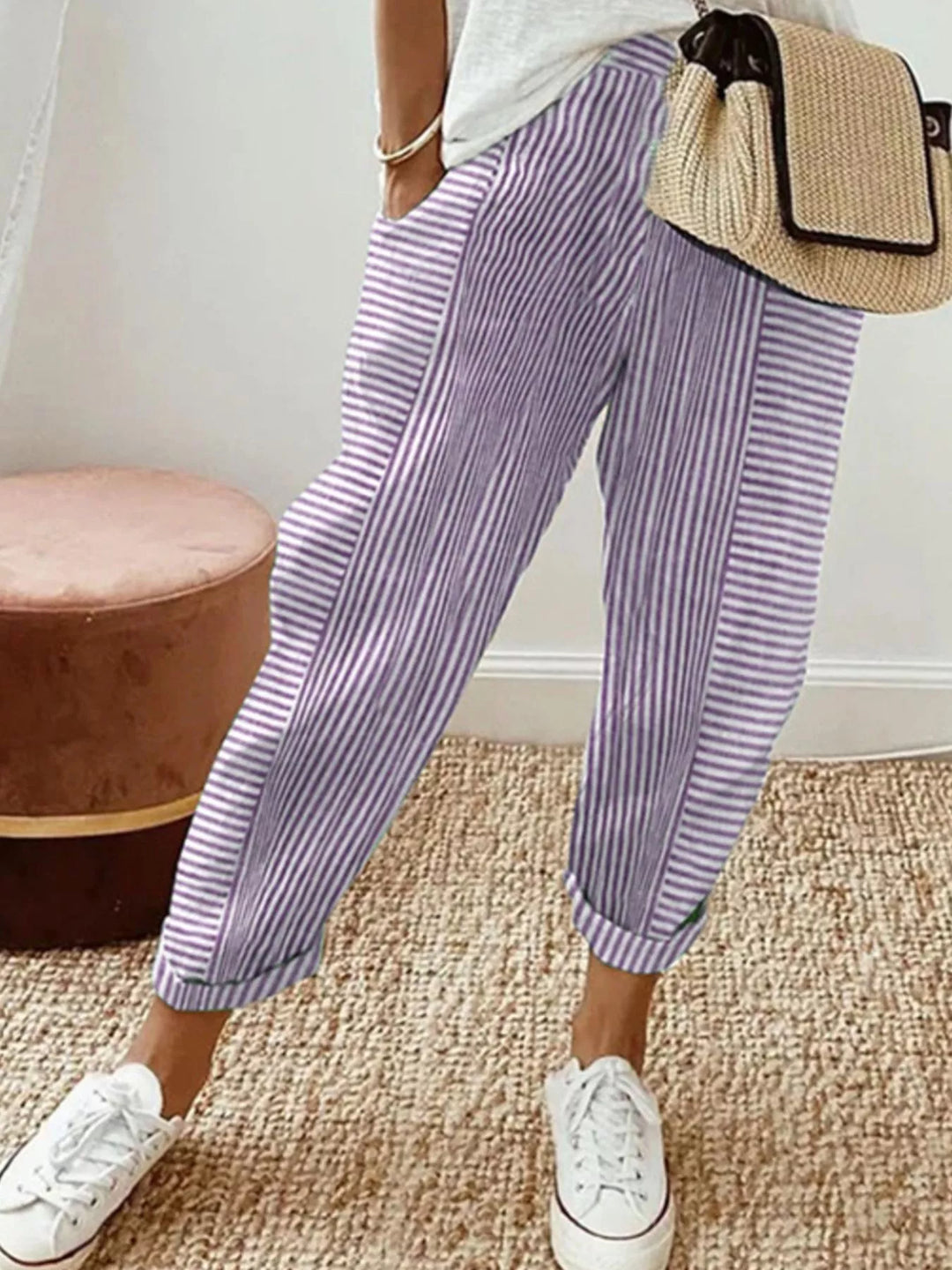 Lilac striped cuffed summer pants worn with white sneakers