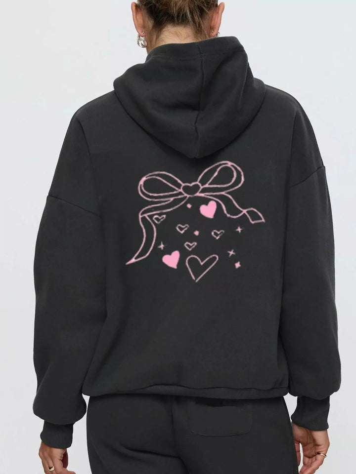 Bow print hoodie and wide leg sweatpants in black, close-up detail