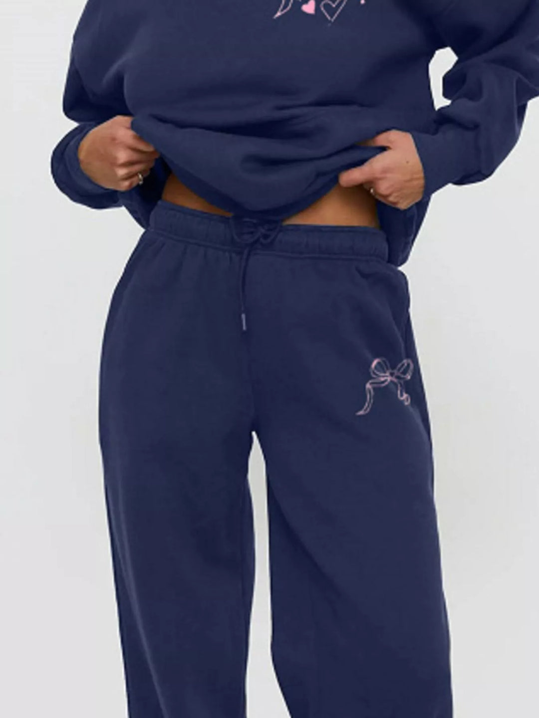 Bow print hoodie and wide leg sweatpants in blue, close-up detail