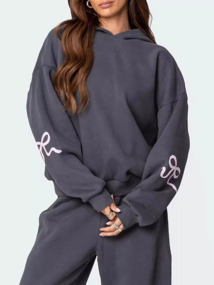Bow print hoodie and wide leg sweatpants in grey, close-up detail