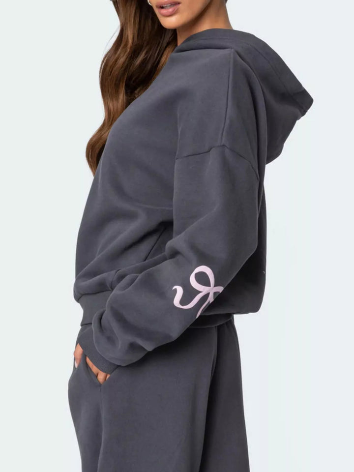 Bow print hoodie and wide leg sweatpants in grey, styled on model