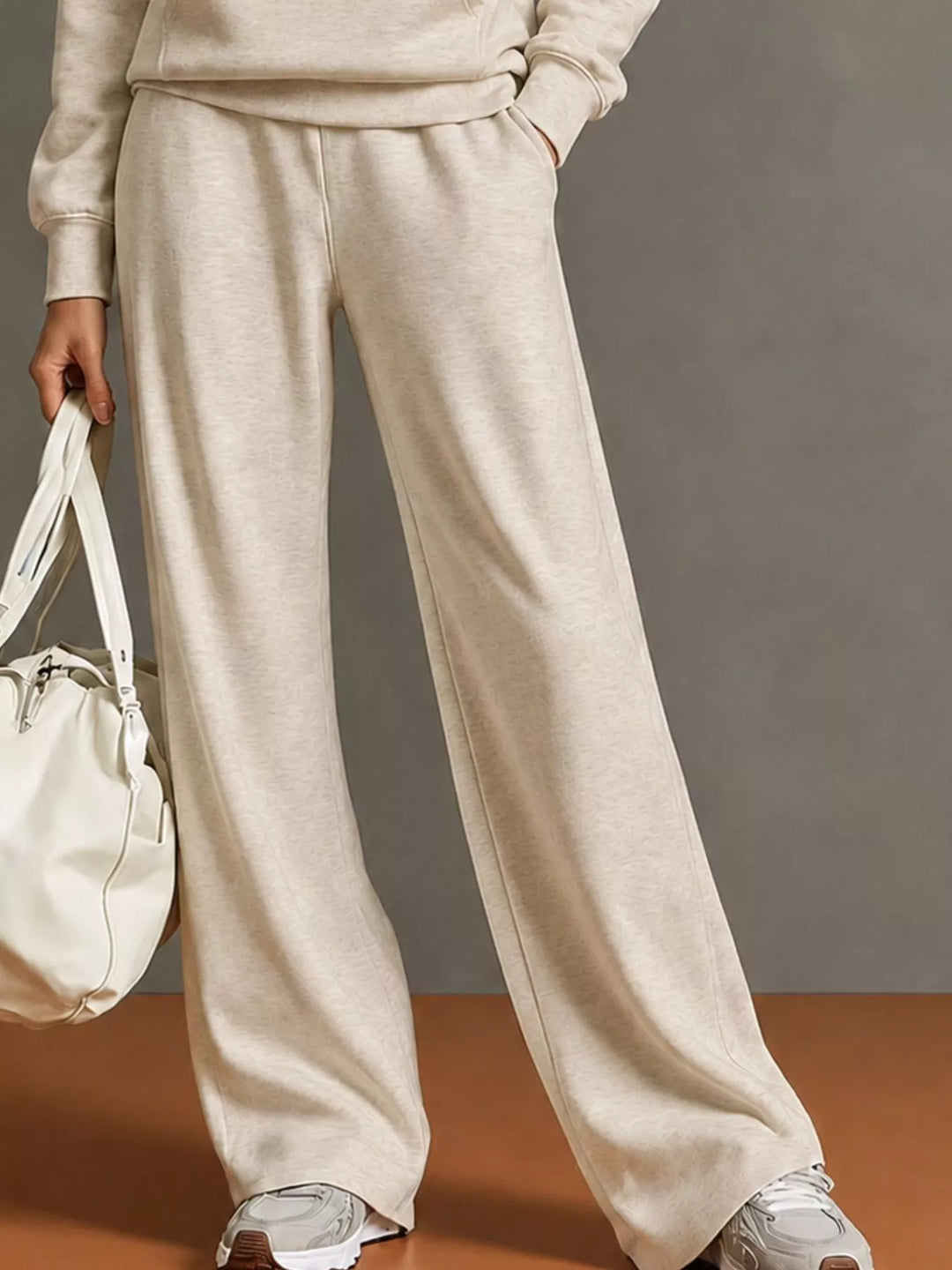 Kangaroo pocket hoodie and wide leg pants in beige, close-up detail 2