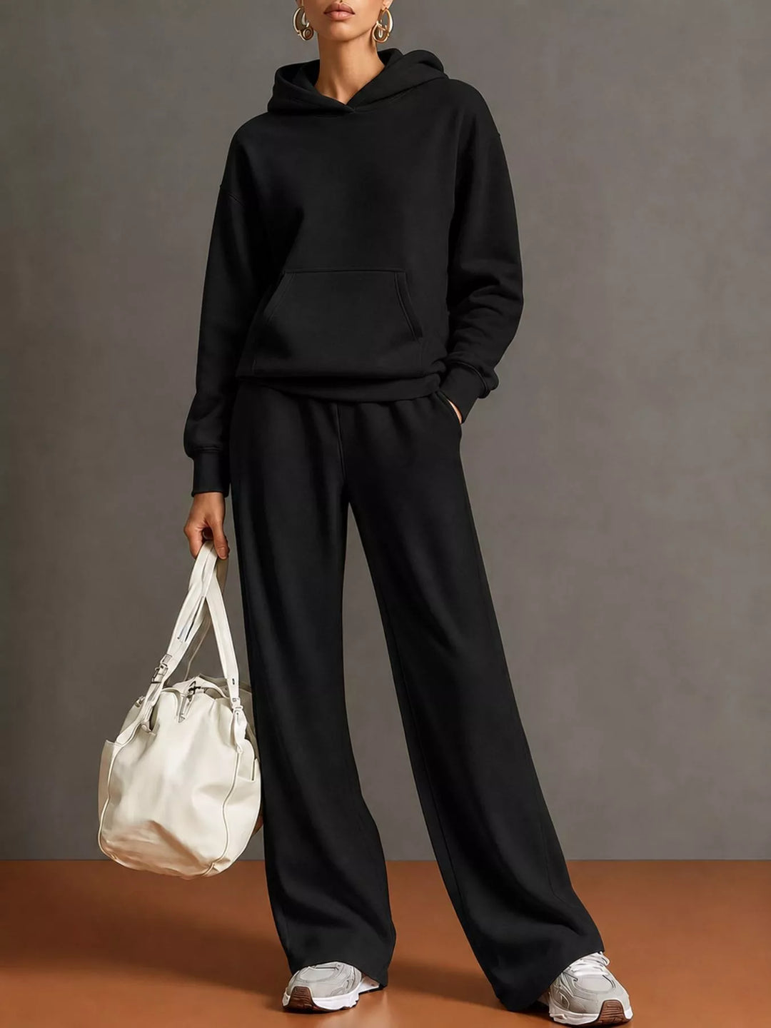 Kangaroo pocket hoodie and wide leg pants in black, front view