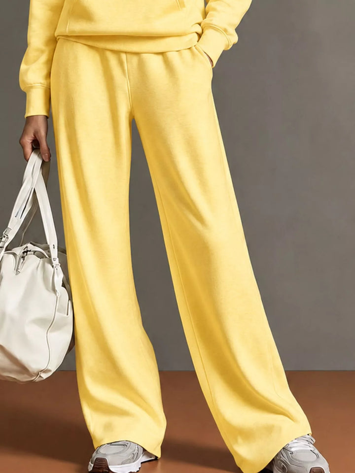 Kangaroo pocket hoodie and wide leg pants in yellow, close-up detail 2