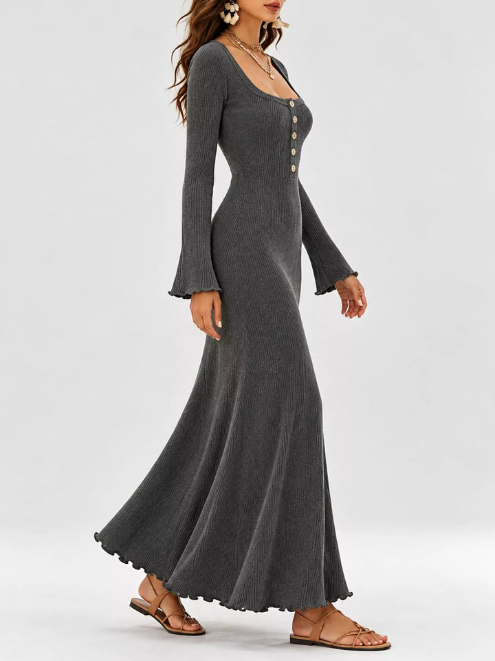 Gray sweater dress worn on a model, showing the ribbed knit look