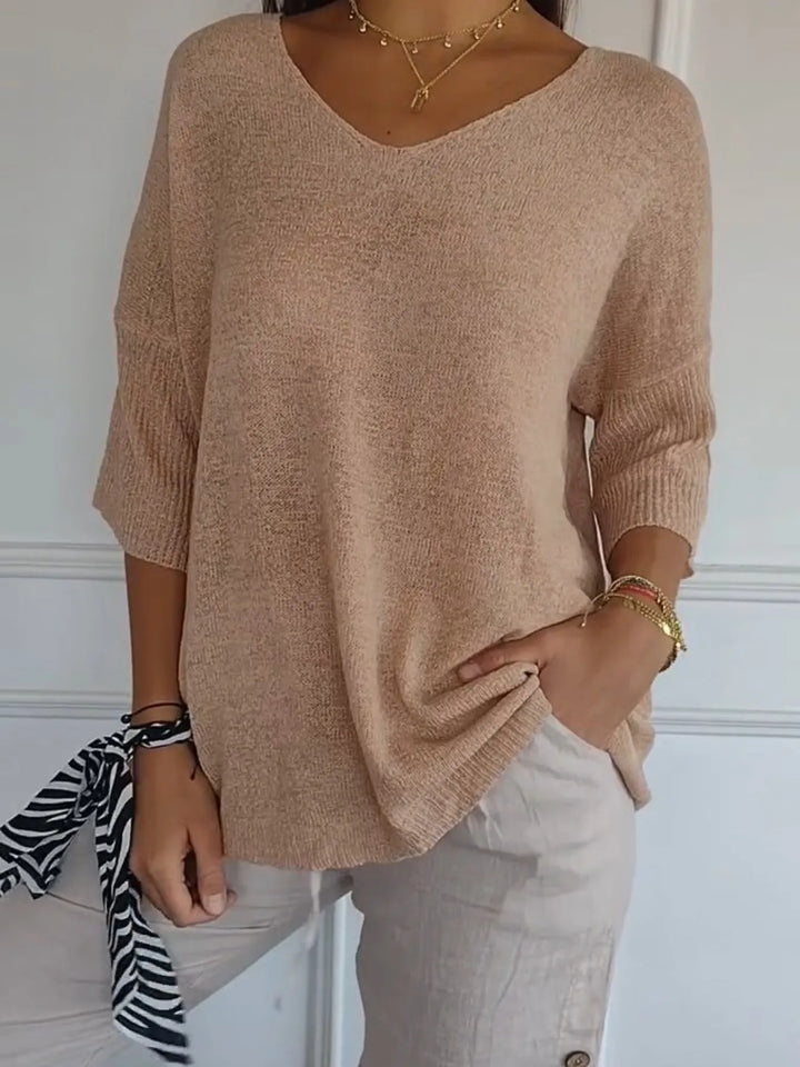 Camel V neck sweater with 3/4 sleeves, styled with a zebra print scarf