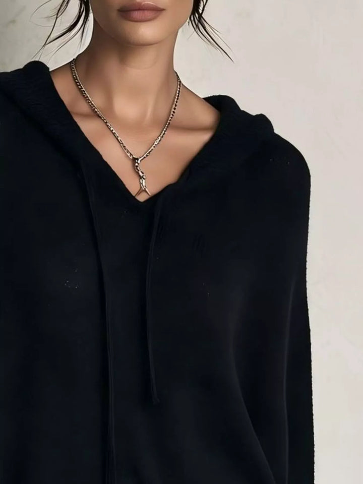 Close-up of the black sweater hood and drawstring