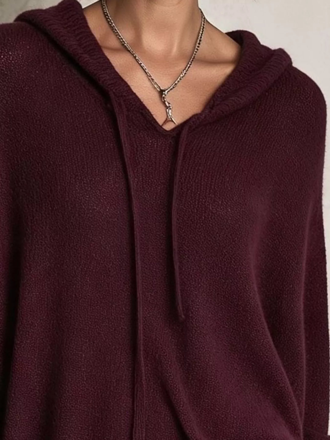 Close-up of the burgundy sweater hood and V neckline