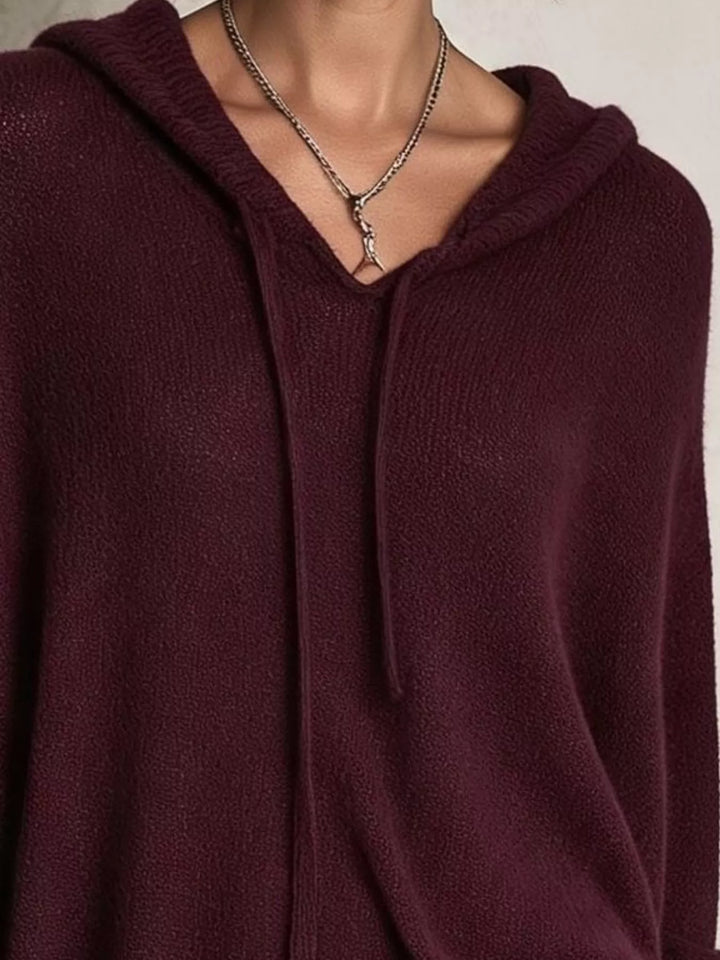 Close-up of the burgundy sweater hood and V neckline