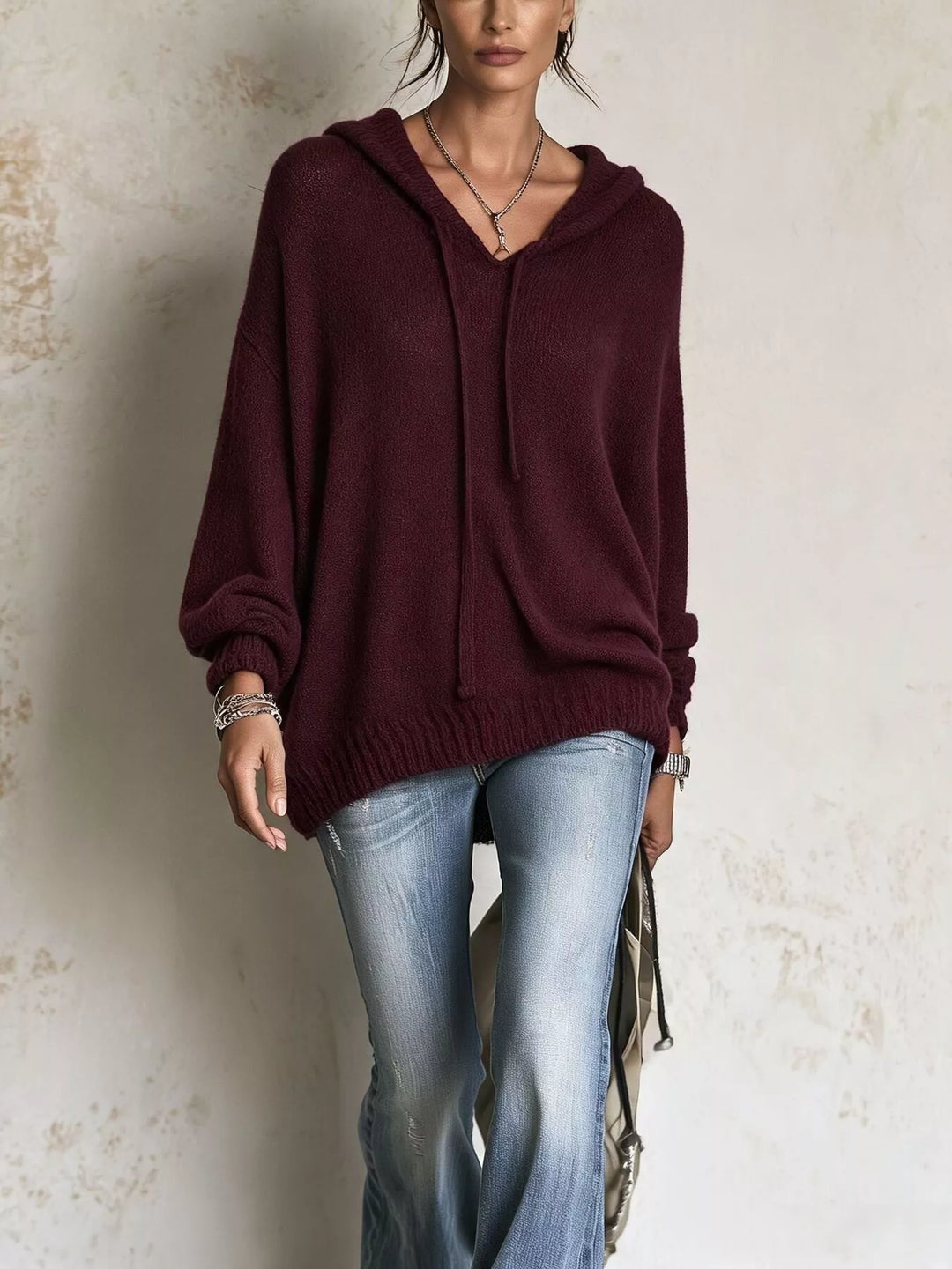 Burgundy oversized hooded sweater with V neckline, front view