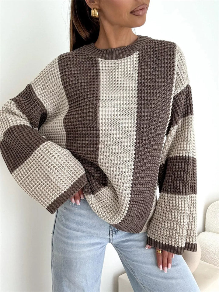 Oversized beige and brown waffle knit sweater with relaxed jeans, three quarter view