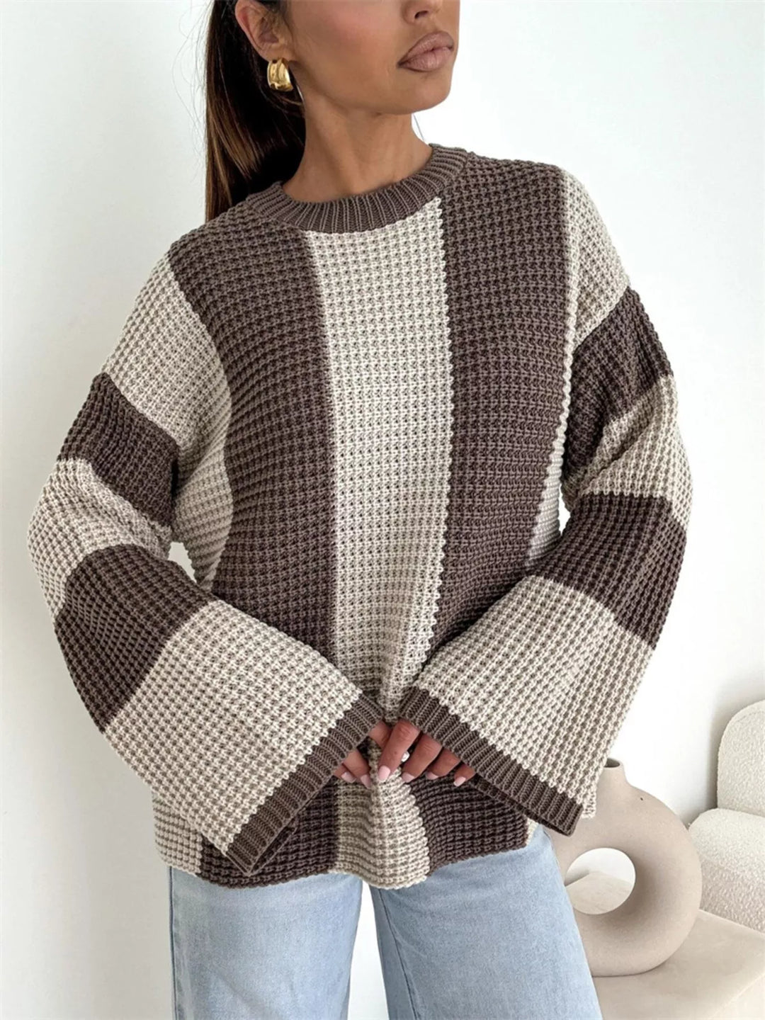 Beige brown color block sweater with flared sleeves, standing front view